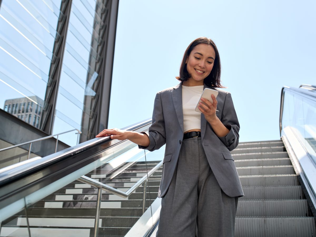 Smiling,Young,Asian,Business,Woman,Wearing,Suit,Standing,On,Urban
